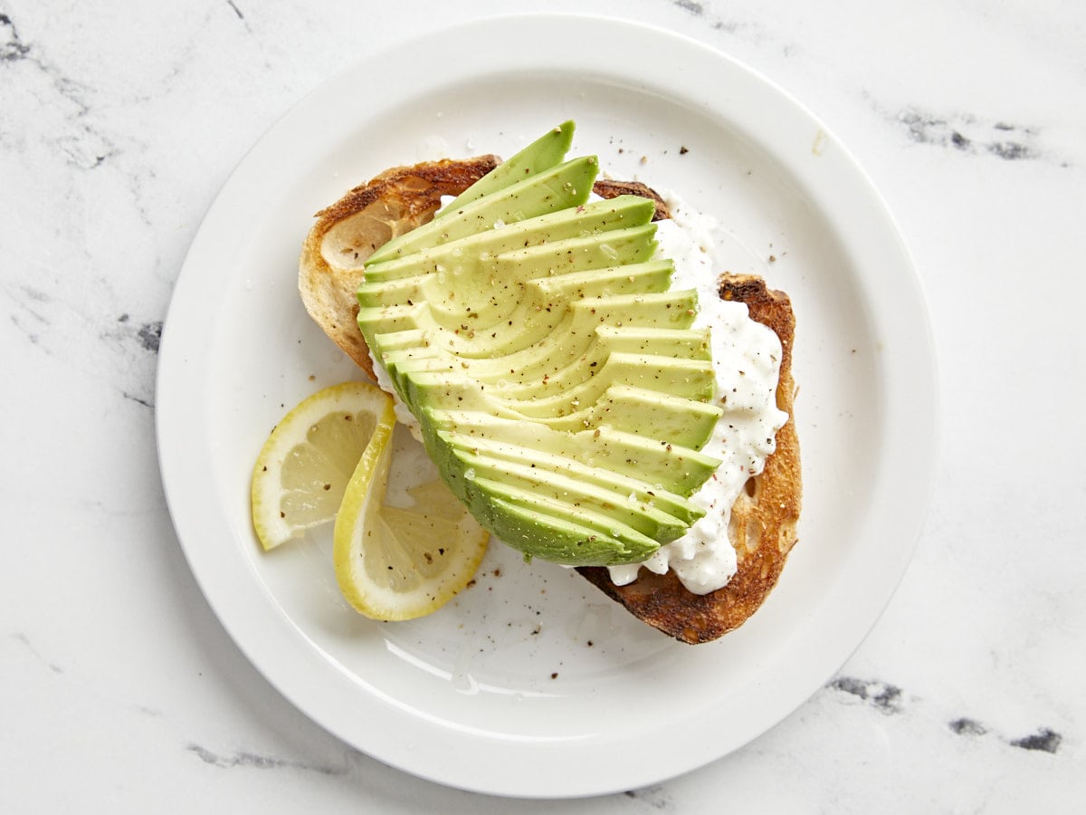 Avocado toast with cottage cheese on top.