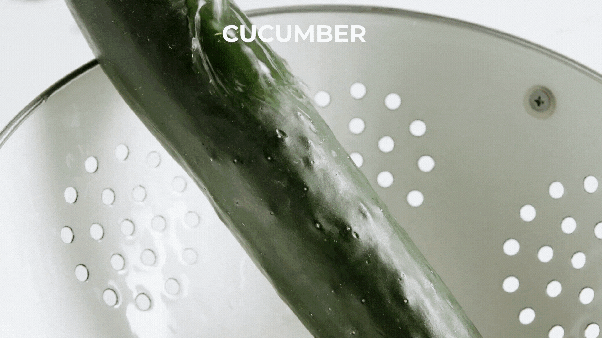 cucumber being washed and peeled