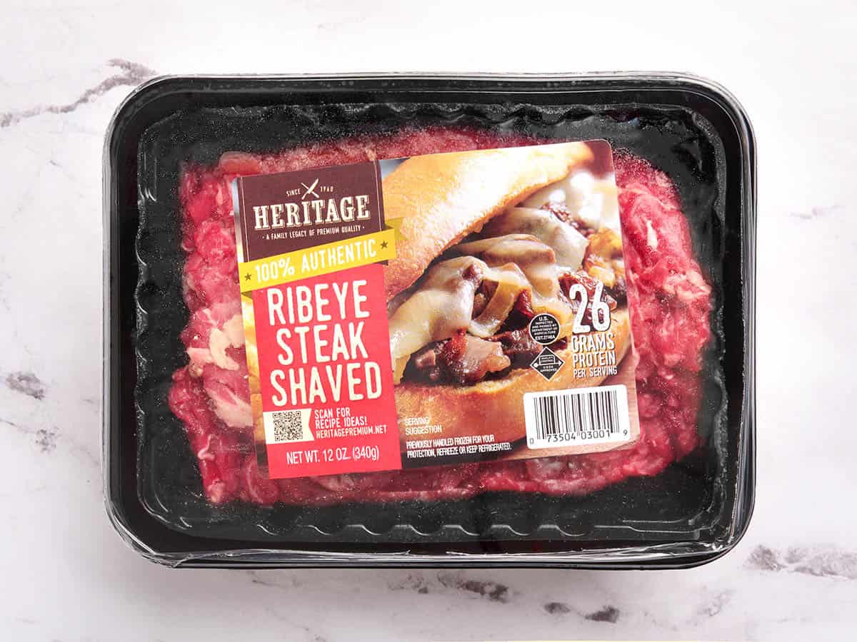 A photo of a package of shaved ribeye steak.