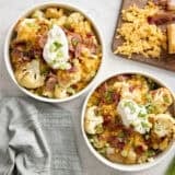 Overhead view of two loaded cauliflower bowls.