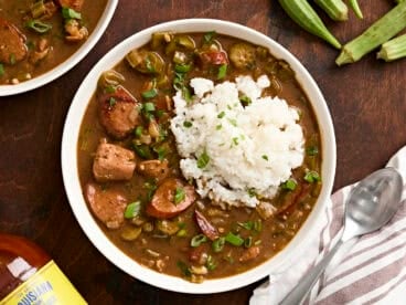 Overhead view of a bowl of gumbo and rice.