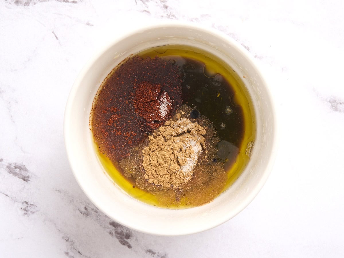 Cowboy caviar dressing ingredients in a bowl.