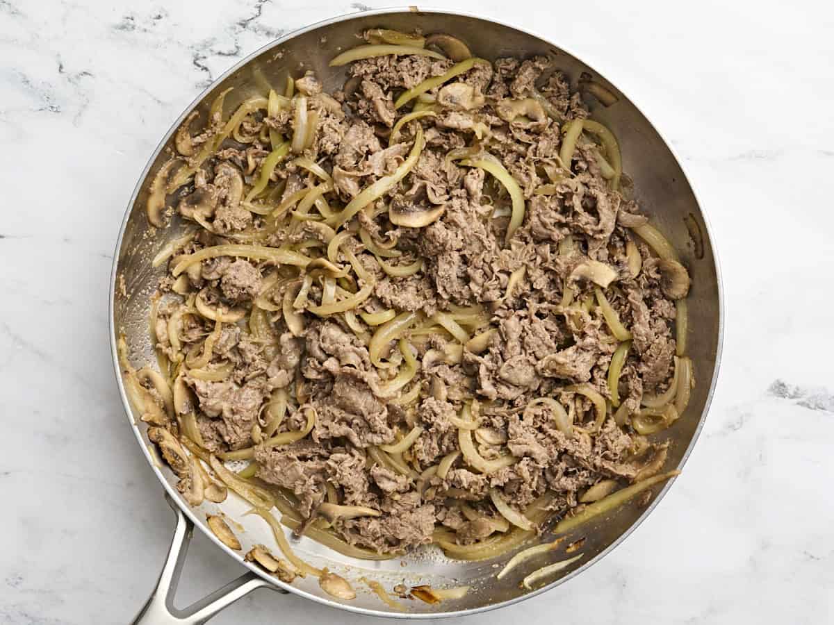 Philly cheesesteak filling in a skillet.