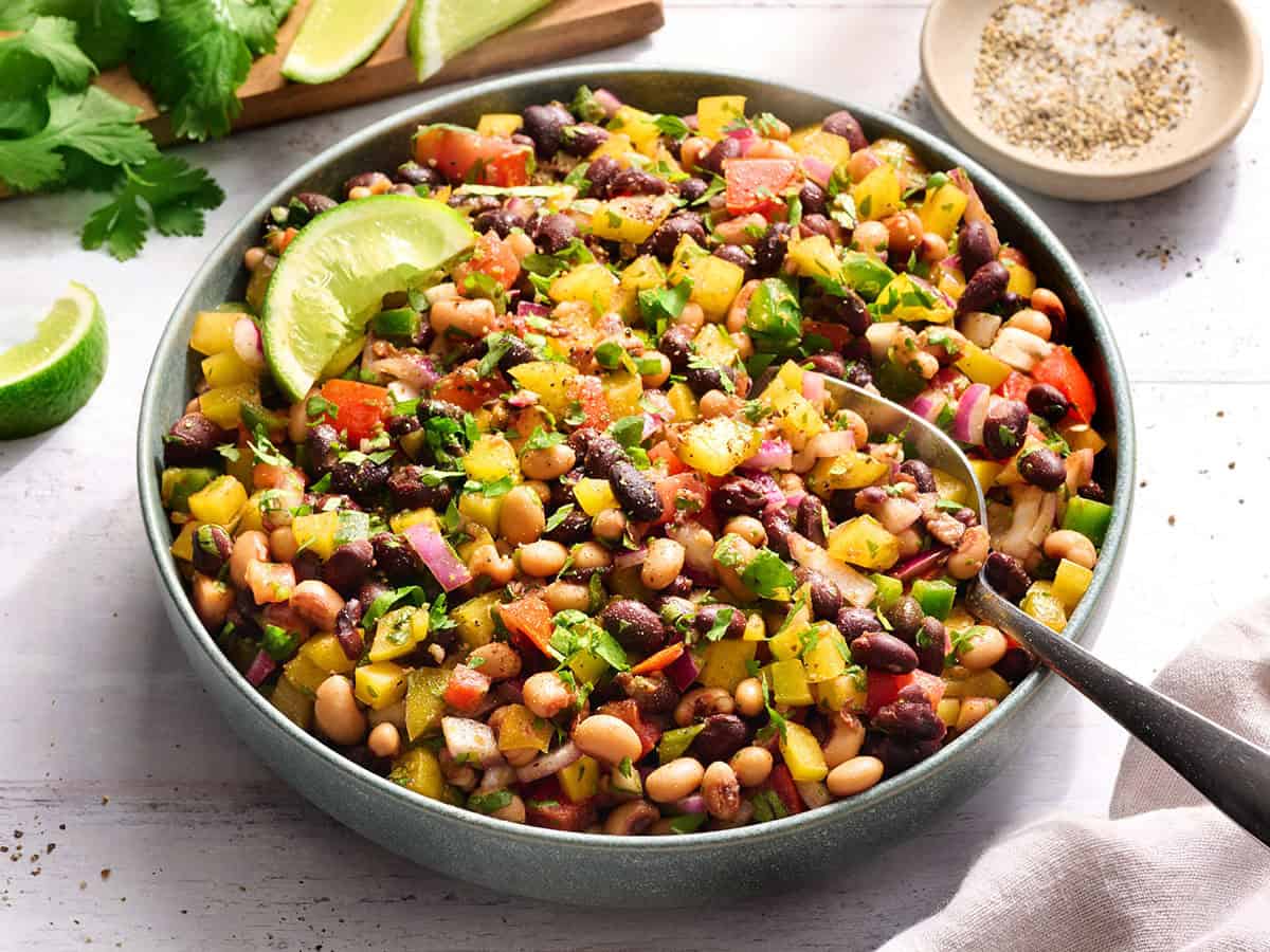 Front view of cowboy caviar in a bowl with a spoon.