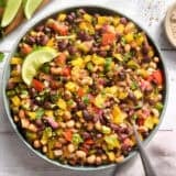 Overhead view of a bowl of cowboy caviar with a spoon.