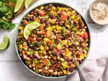 Overhead view of a bowl of cowboy caviar with a spoon.