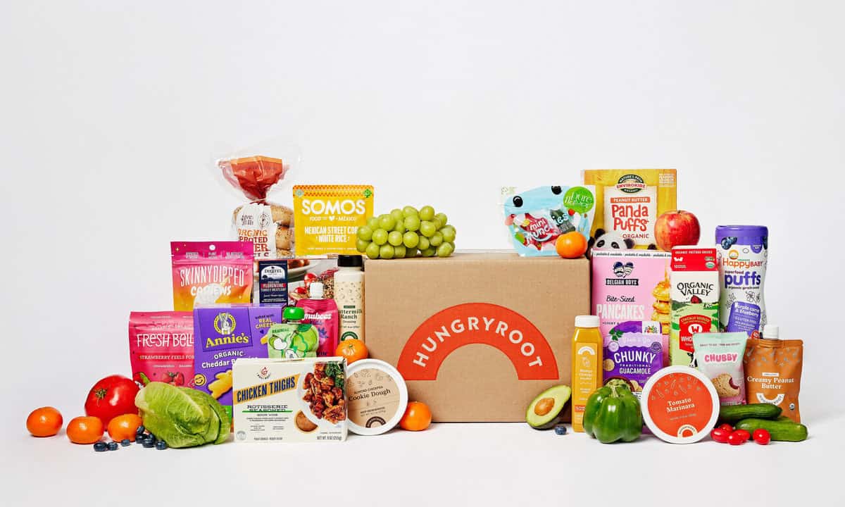 A stock image of a Hungry Root box surrounded by examples of foods you can receive from them.