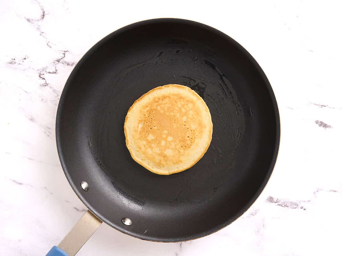A homemade pancake in a skillet.