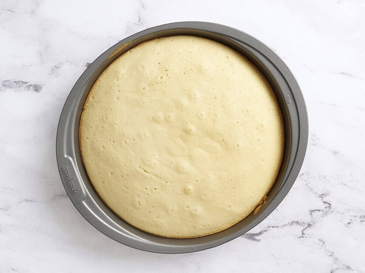 Baked vanilla cake in a baking dish.