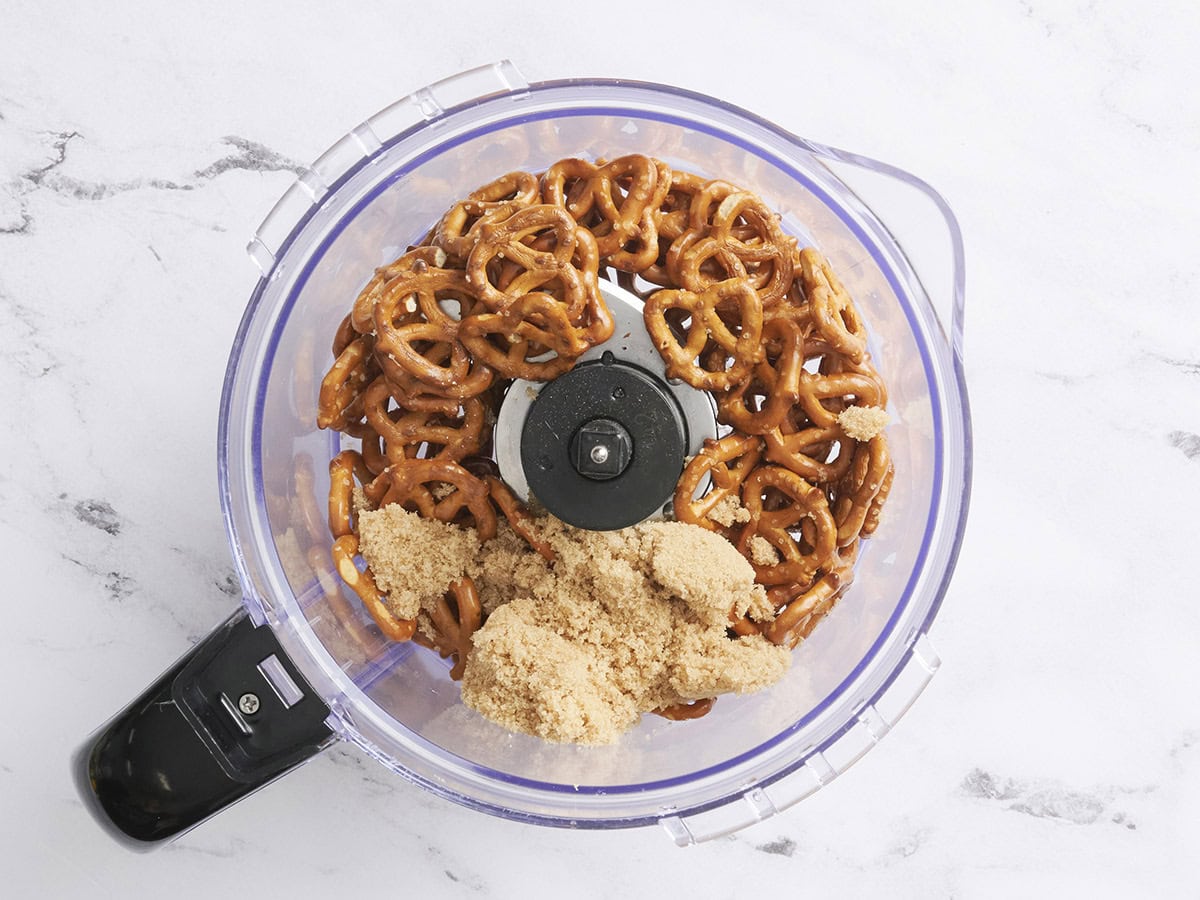Salted pretzels and brown sugar in a food processor.