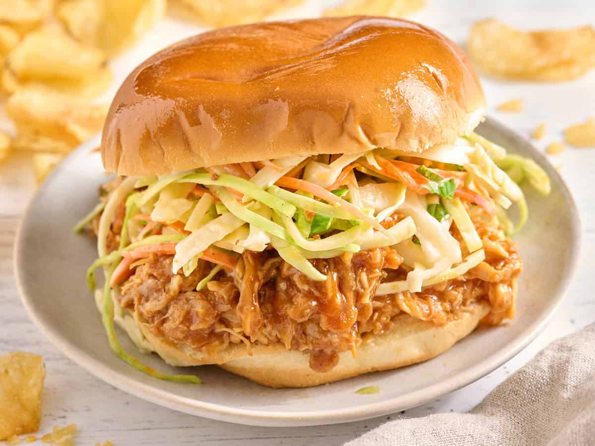 Front view of a bbq chicken burger with coleslaw.