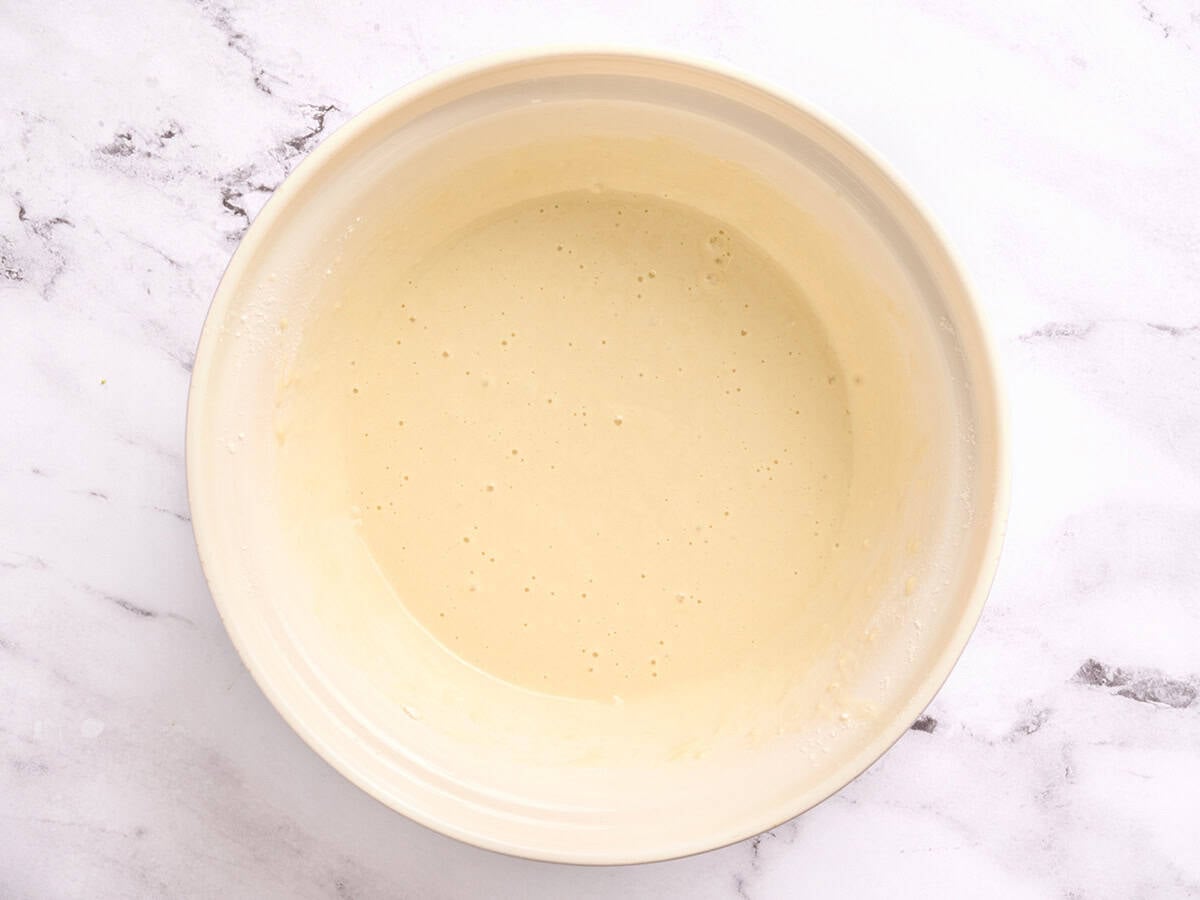 Smooth pancake batter in a bowl.