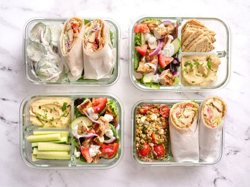 Overhead of chicken shawarma meal prep boxes.