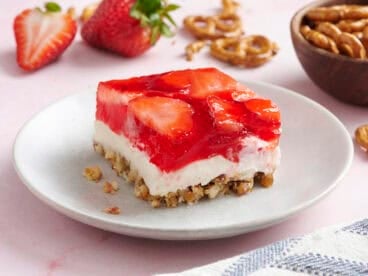 Side view of a slice of homemade strawberry pretzel salad.