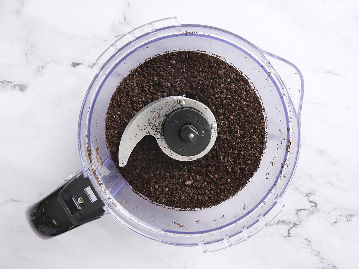 Ground coffee beans in a food processor.
