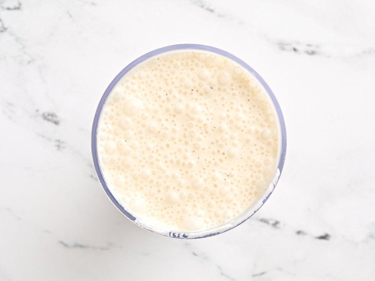 Vegetarian caesar dressing in a mixing bowl after blending.