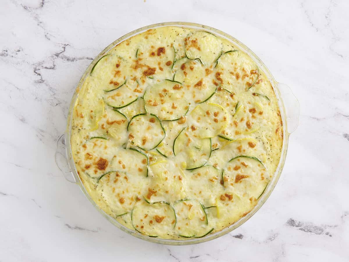 Finished sweet corn and zucchini pie in a pie dish.