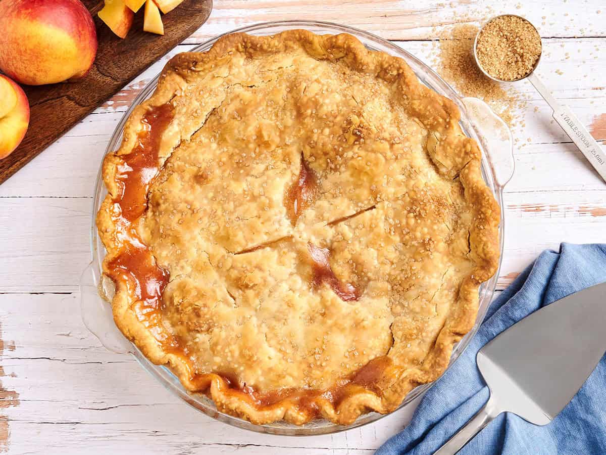 Overhead view of a homemade peach pie.