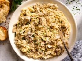 Overhead view of a plate of crockpot chicken tetrazzini with a fork.