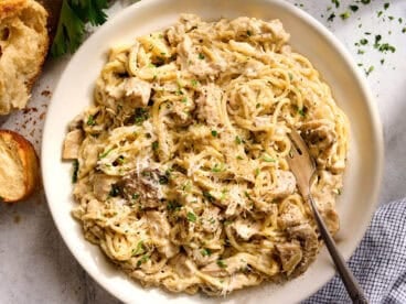 Overhead view of a plate of crockpot chicken tetrazzini with a fork.