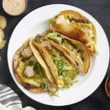 Overhead view of a plate of homemade smash burger tacos.