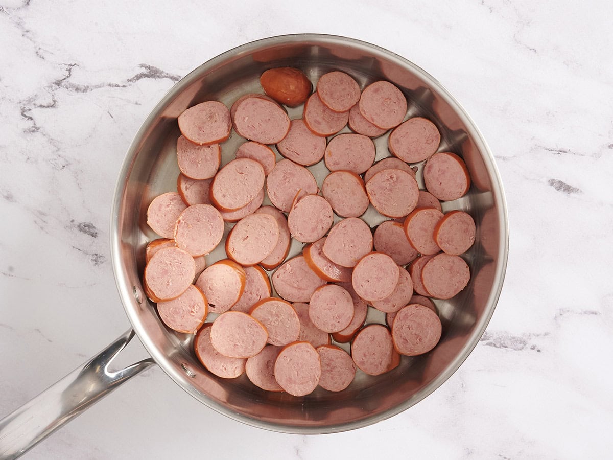 Sliced turkey sausage in a skillet.