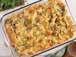 Overhead view of a turkey sausage and kale casserole in a baking dish.