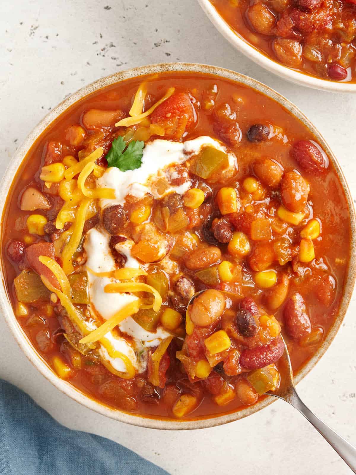 overhead view of vegetarian chili topped with all the fixings