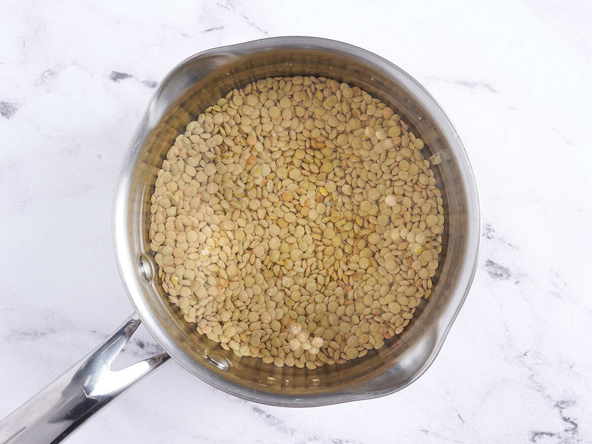 Lentils cooking in a saucepan.