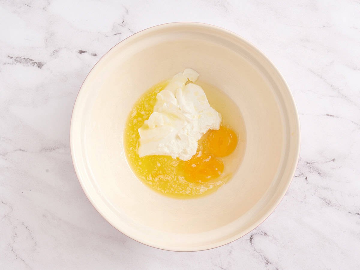 Mix wet ingredients in a white bowl.