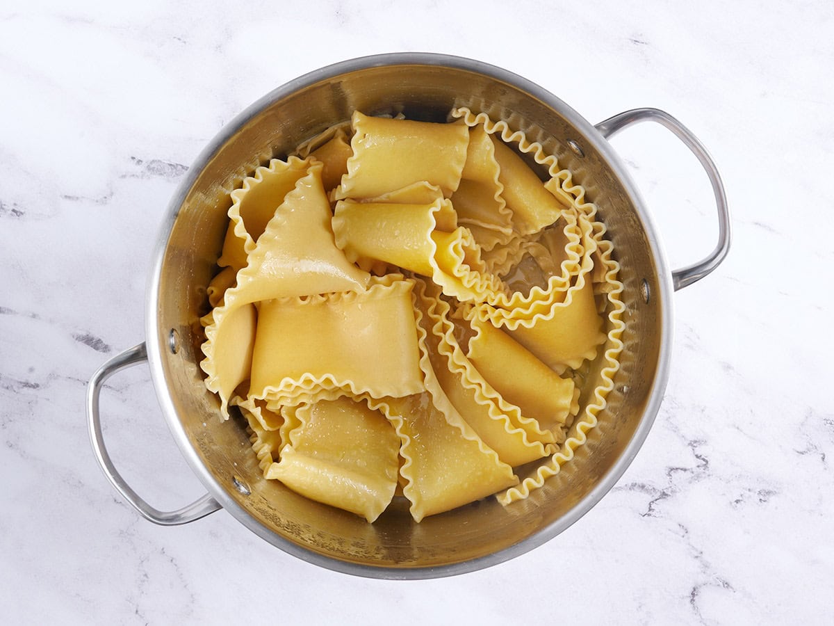 Cooked lasagna noodles tossed in olive oil.