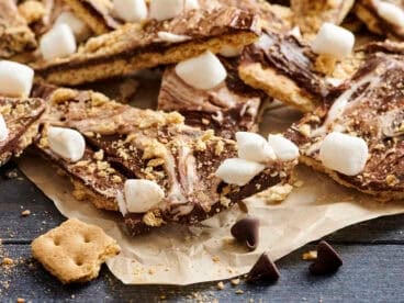 S'mores bark on a piece of parchment paper.