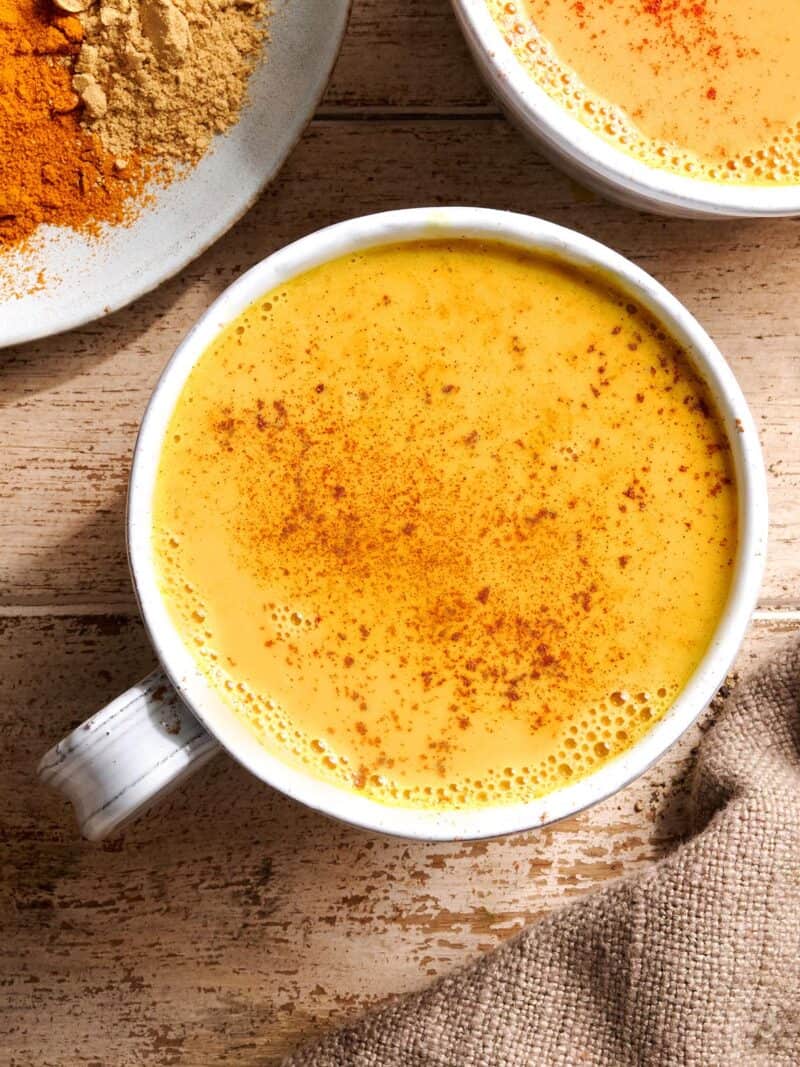 Overhead view of a cup of golden milk.