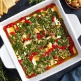 Overhead view of a pan of marinated cheese.