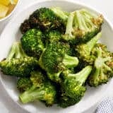 Overhead view of air fryer broccoli on a plate.