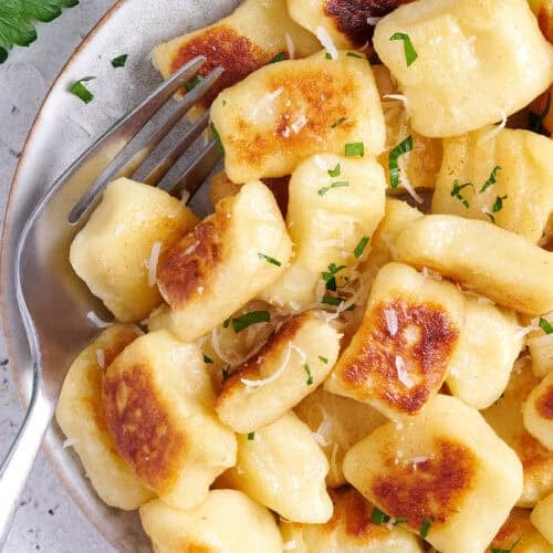 Plate of panfried potato gnocchi.
