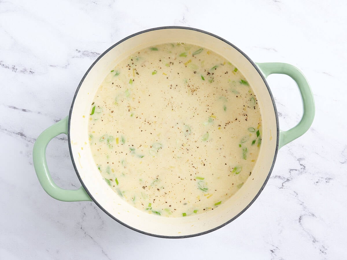 Creamy potato and leek soup in a pot.