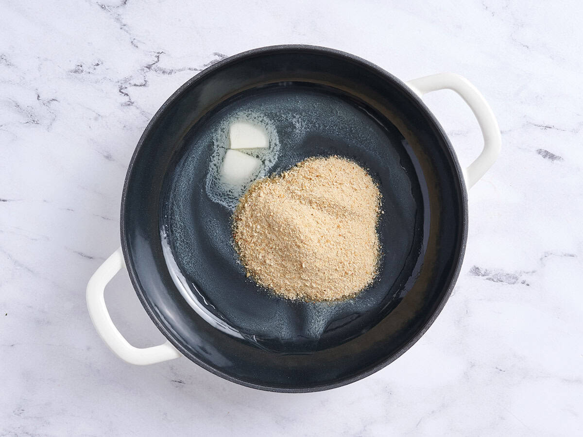 Breadcrumbs and butter in a braiser.