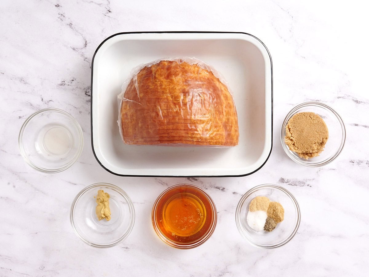 The ingredients to make honey glazed ham.