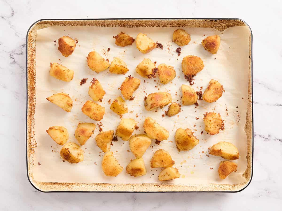 Roasted potatoes on a tray.