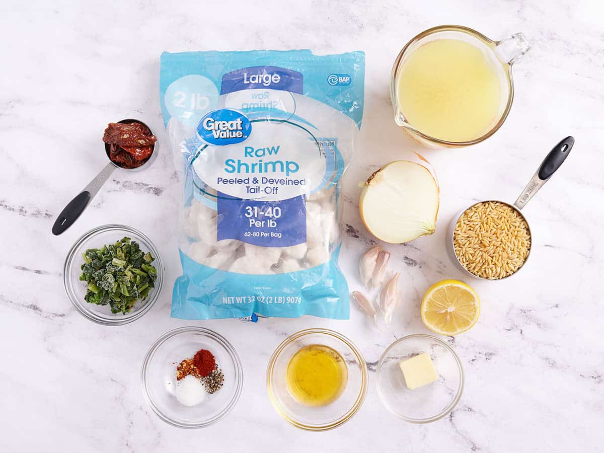 The ingredients to make a garlic shrimp and orzo skillet.