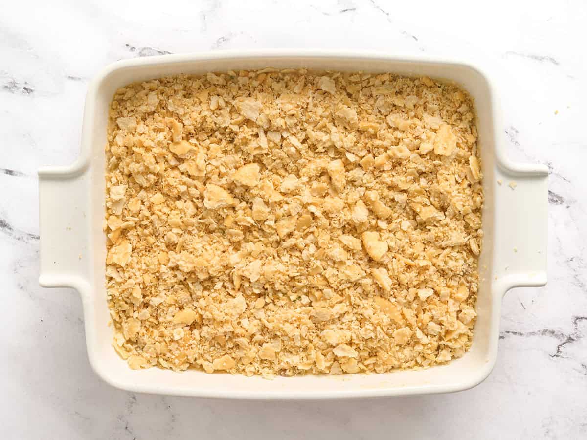A million dollar chicken casserole with cracker topping before baking.