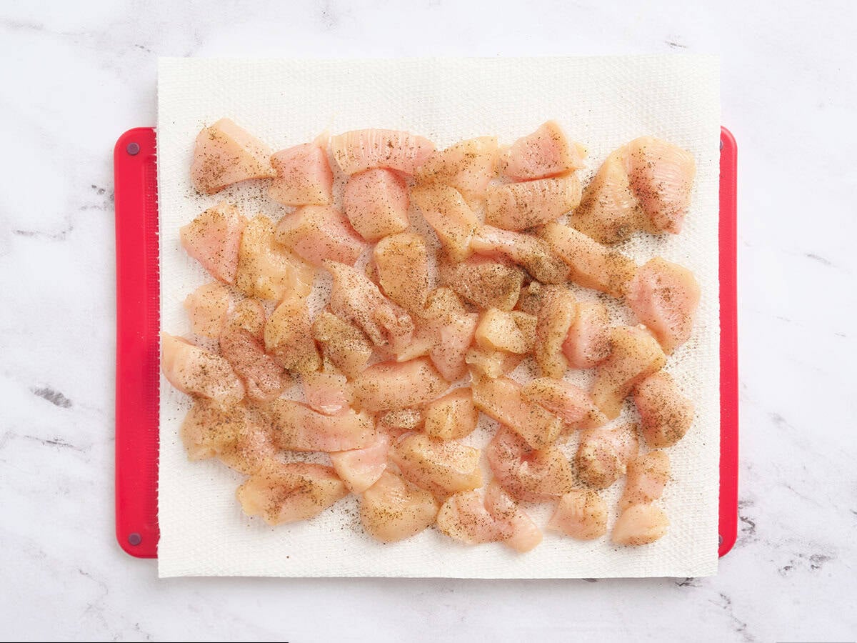 Diced chicken on a cutting board.