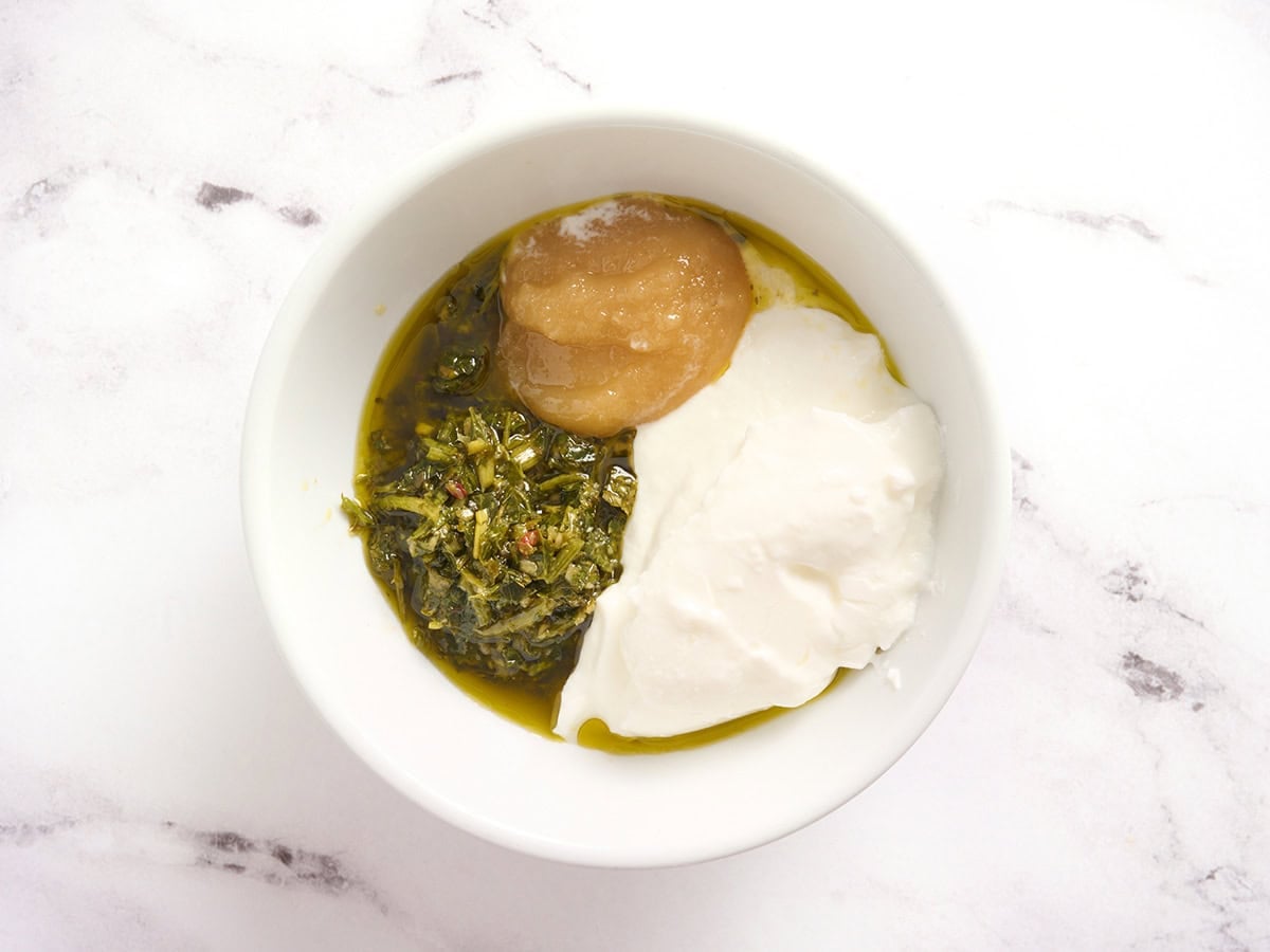 Chimichurri marinade in ingredients in a bowl.