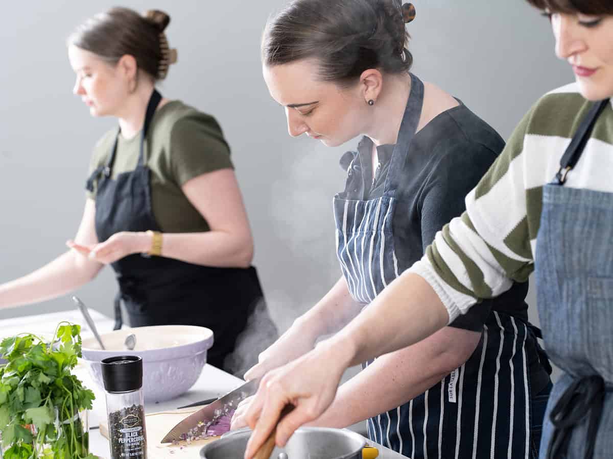 three woman cooking