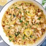 Overhead view of a garlic shrimp and orzo skillet.