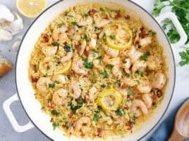 Overhead view of a garlic shrimp and orzo skillet.