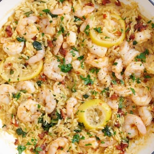 Overhead view of a garlic shrimp and orzo skillet.