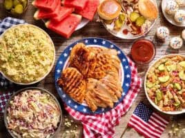 Overhead view of a 4th of July cookout table spread.