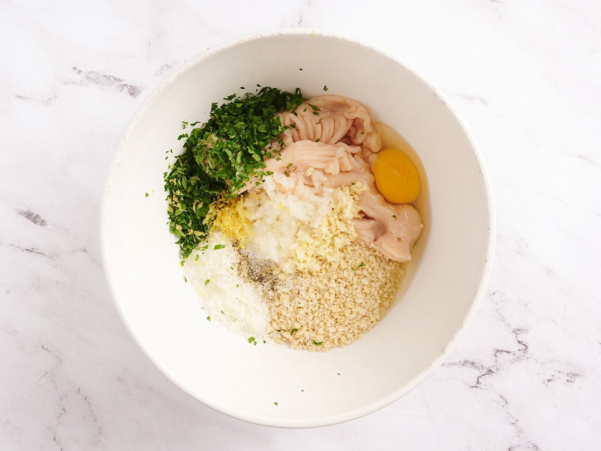 The ingredients to make chicken piccata meatballs in a bowl.